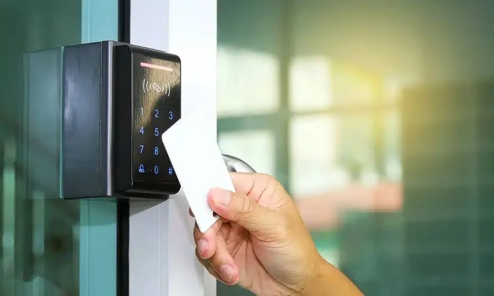Office worker using keycard entry Office worker using keycard entry